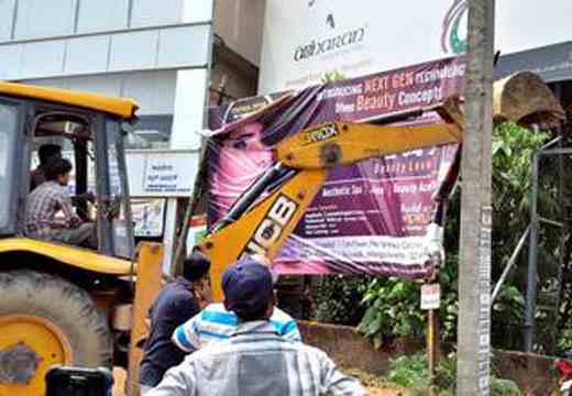 Unauthorised hoardings brought down
